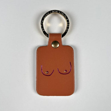 Image of burnt orange boob key fob