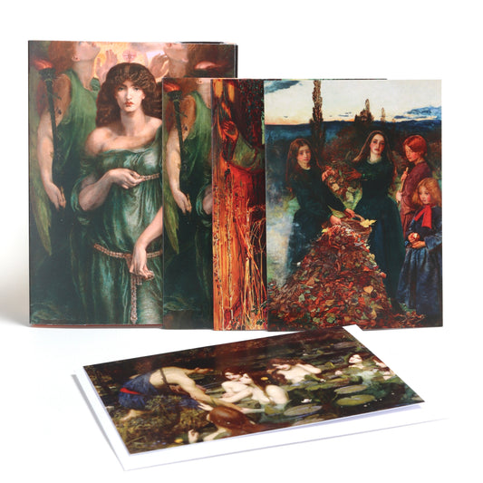 Pack of greetings cards photographed on a white background. The cards feature artworks by the Pre-Raphaelite Brotherhood. Including Autumn Leaves by John William Waterhouse, Astarte Syriaca by Dante Gabriel Rossetti and Hylas and the Nymphs by John William Waterhouse.