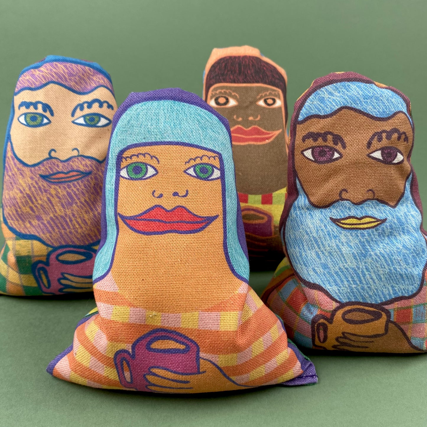 fabric lavender bags with illustrated faces of people holding a mug