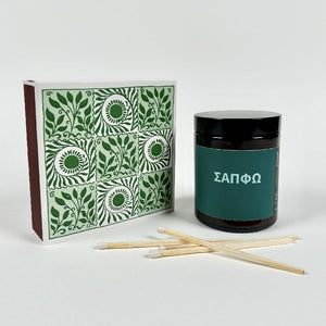 Image of the Sappho inspired candle set next to a box of matches