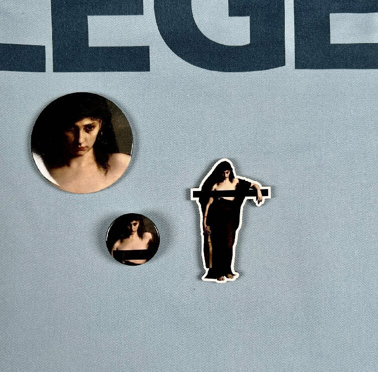 Image of Sappho censored fridge magnet, pin badge and handbag mirror on Sappho legend bag.