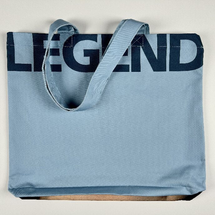 Image of the Sappho tote with the World Legend across the top